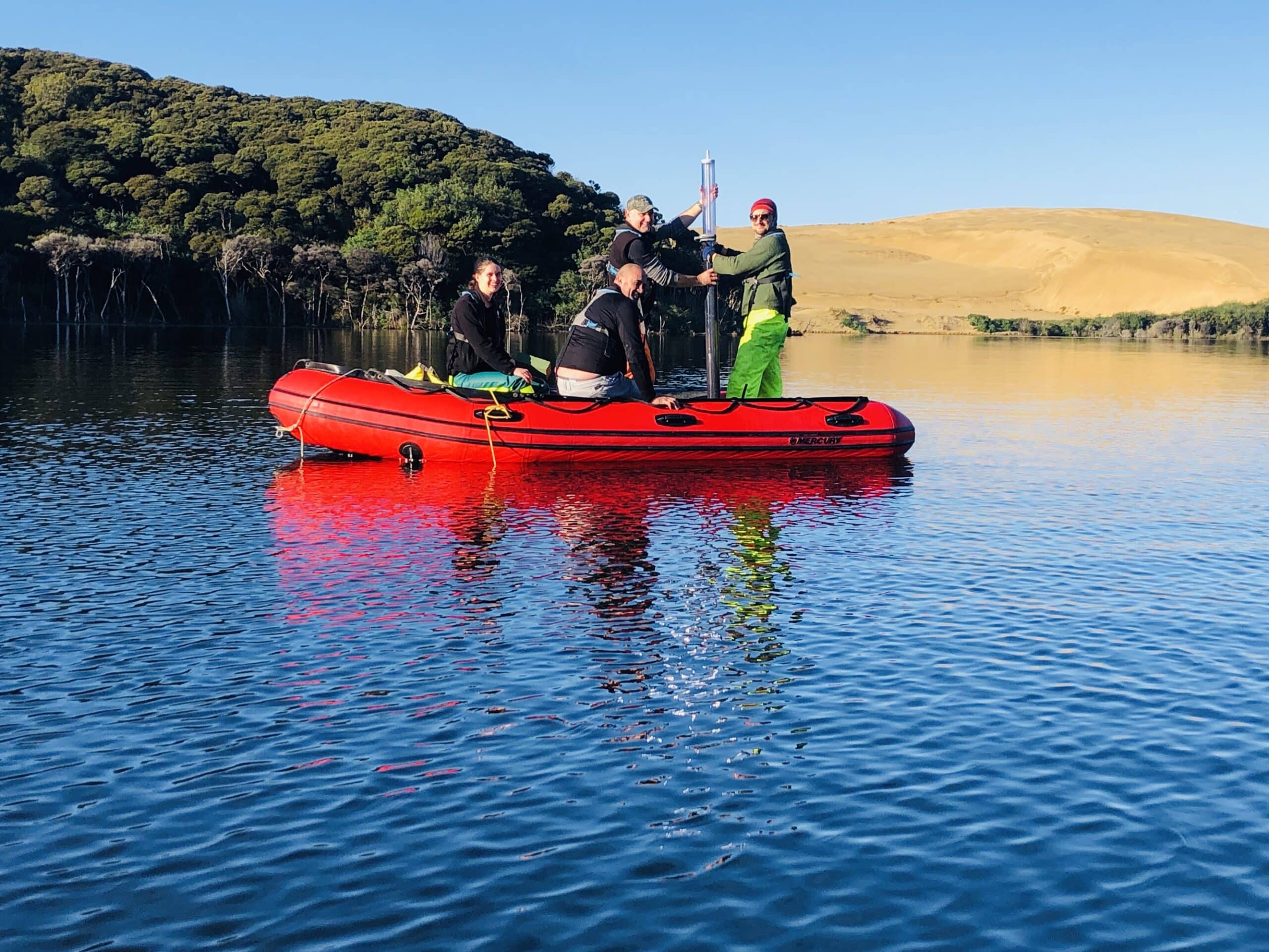 Sampling lake sediments at Lake Wai Raupo